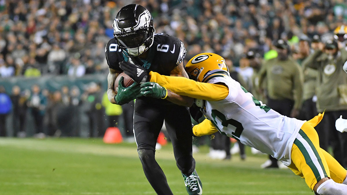 Philadelphia Eagles wide receiver DeVonta Smith (6) is tackled by Green Bay Packers cornerback Jaire Alexander (23) during the third quarter at Lincoln Financial Field.
