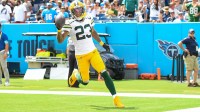 Green Bay Packers cornerback Jaire Alexander (23) scores on a pick six thrown by Tennessee Titans Will Levis (8) during the first half at Nissan Stadium.