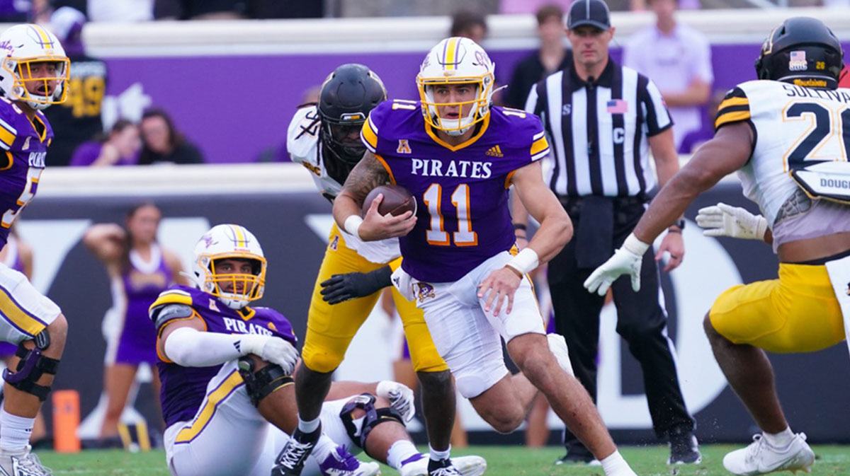 East Carolina Pirates quarterback Jake Garcia (11) runs with the ball against the Appalachian State Mountaineers during the first half at Dowdy-Ficklen Stadium.