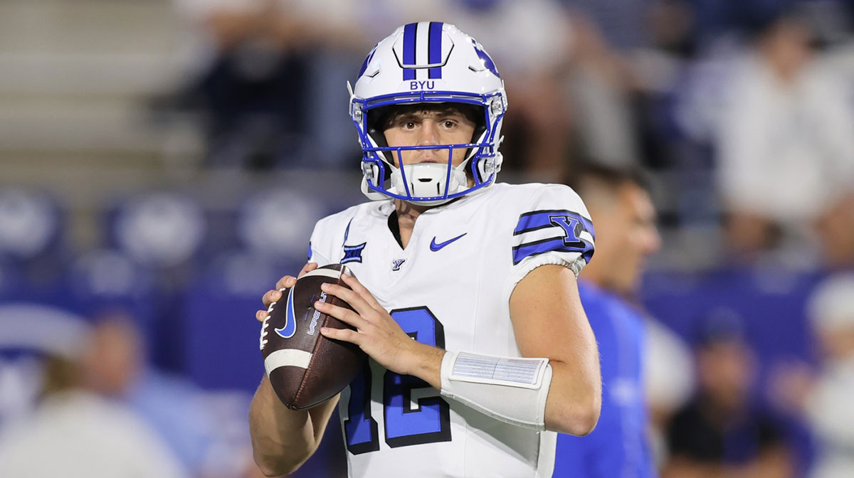 Brigham Young Cougars quarterback Jake Retzlaff (12) warms up before the game against the Kansas State Wildcats at LaVell Edwards Stadium.