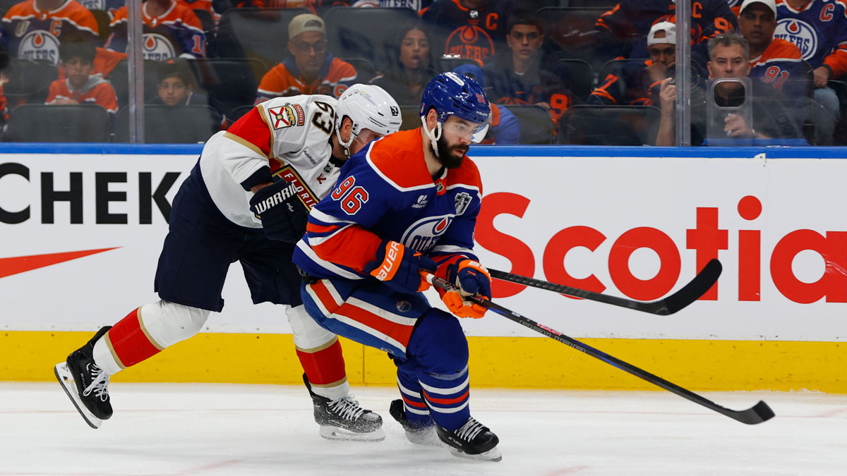 Edmonton Oilers defenseman Jake Walman (96) controls the puck against Florida Panthers forward Brad Marchand (63) during the second period in game five of the 2025 Stanley Cup Final at Rogers Place.