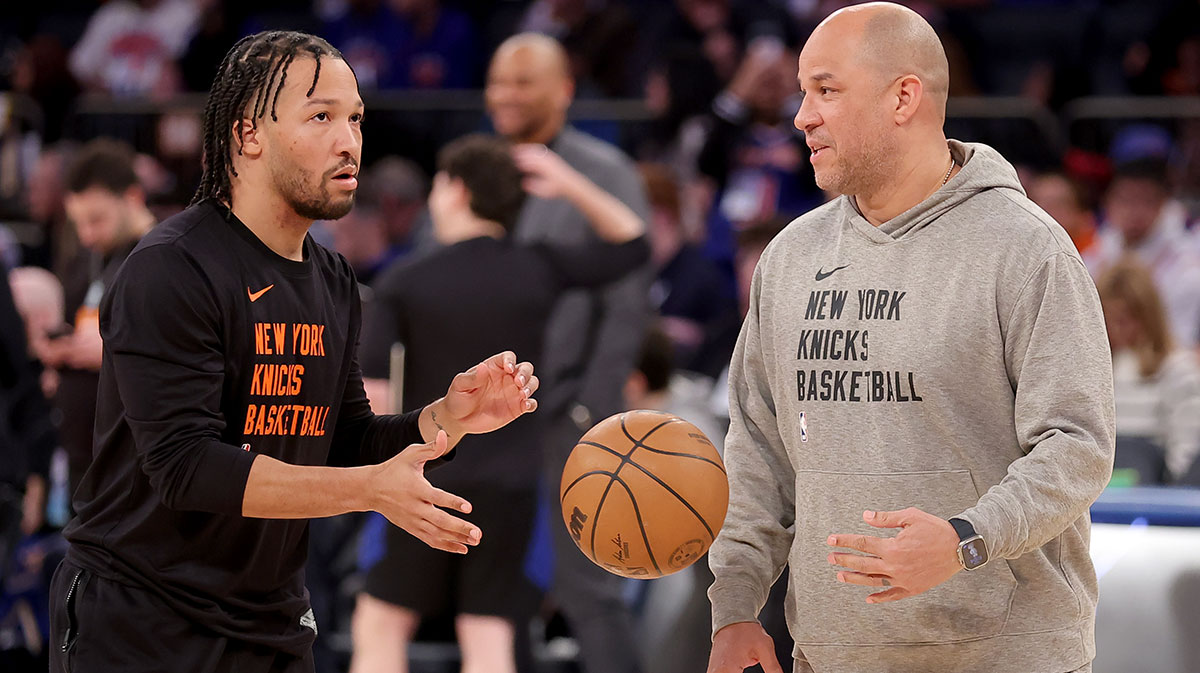 New York Knicks guard Jalen Brunson (11) warms up with assistant coach Rick Brunson (right) before a game against the Golden State Warriors at Madison Square Garden.