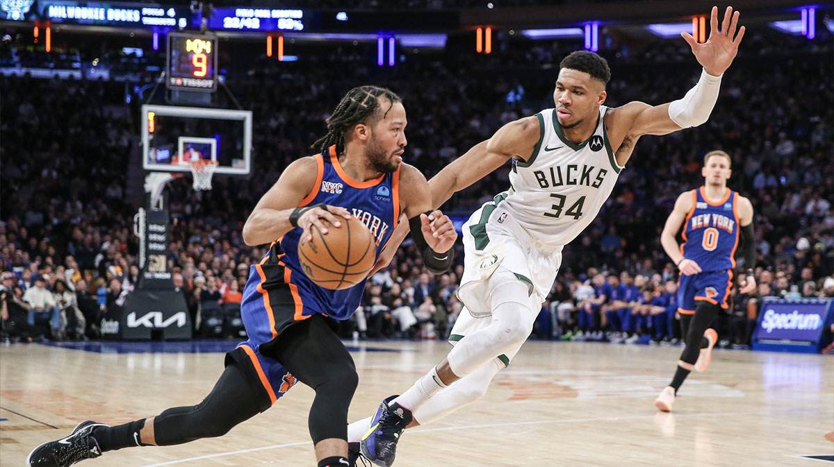 New York Knicks guard Jalen Brunson (11) looks to drive past Milwaukee Bucks forward Giannis Antetokounmpo (34) in the second quarter at Madison Square Garden.