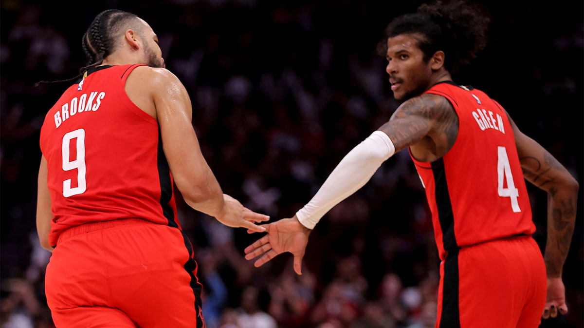 Houston Rockets forward Dillon Brooks (9) congratulates Houston Rockets guard Jalen Green (4) after a made basket against the Chicago Bulls during the fourth quarter at Toyota Center.