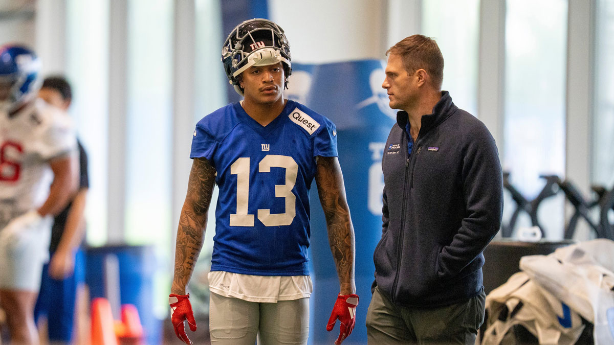 New York Giants wide receiver Jalin Hyatt (13) talks with an assistant coach during Mandatory Minicamp at Quest Diagnostics Giants Training Center in East Rutherford on Tuesday, June 17, 2025.