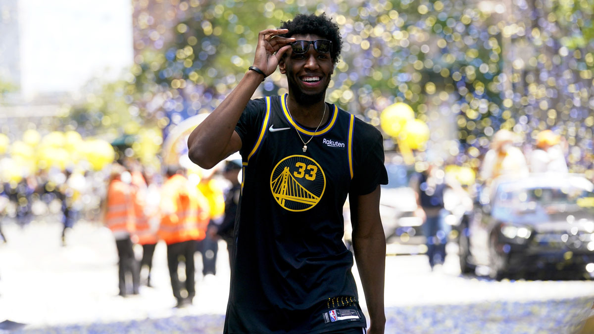 Golden State Warriors center James Wiseman (33) walks on the street during the Warriors championship parade in downtown San Francisco.