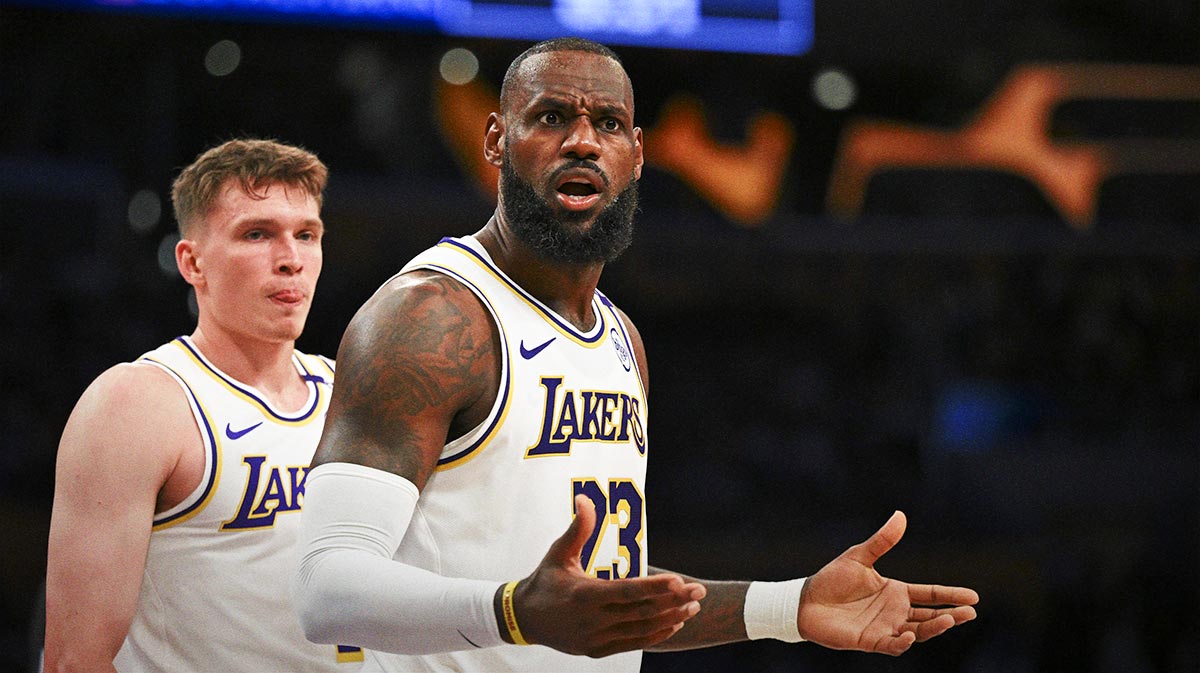 Los Angeles Lakers forward LeBron James (23) and guard Dalton Knecht (4) reacts to a ref’s call against the Sacramento Kings during the first half at Crypto.com Arena.