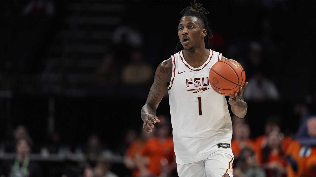 Florida State Seminoles guard Jamir Watkins (1) brings the ball up court against the Syracuse Orange during the second half at Spectrum Center.