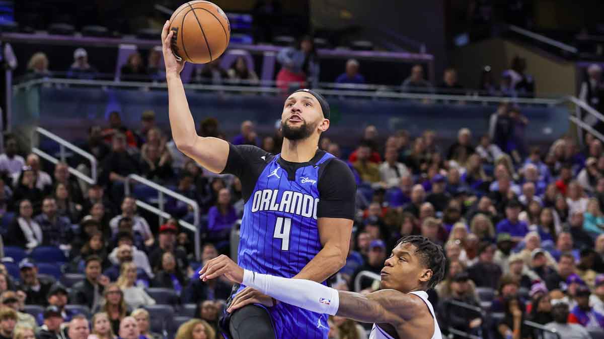 Jan 25, 2025; Orlando, Florida, USA; Orlando Magic guard Jalen Suggs (4) is fouled by Detroit Pistons guard Marcus Sasser (25) during the second half at Kia Center. Mandatory Credit: Mike Watters-Imagn Images