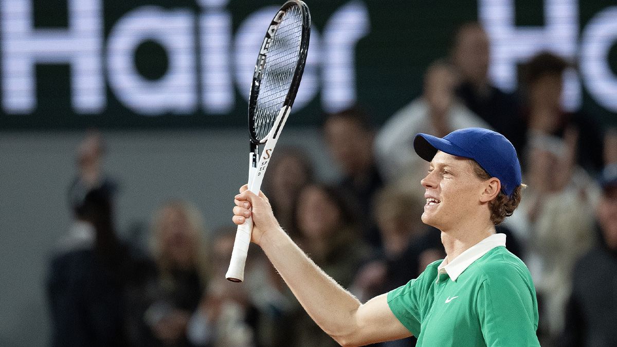 Jannik Sinner of Italy celebrates winning his match against Novak Djokovic of Serbia on day 13 at Roland Garros Stadium.