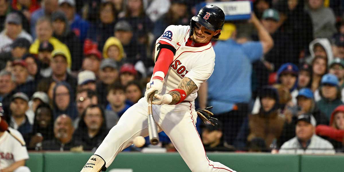 Boston Red Sox outfielder Jarren Duran (16) hits a double against the New York Mets during the fourth inning at Fenway Park.