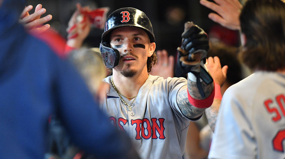 Boston Red Sox left fielder Jarren Duran (16) celebrates with teammates in the dugout after scoring during the fourth inning against the Milwaukee Brewers at American Family Field.