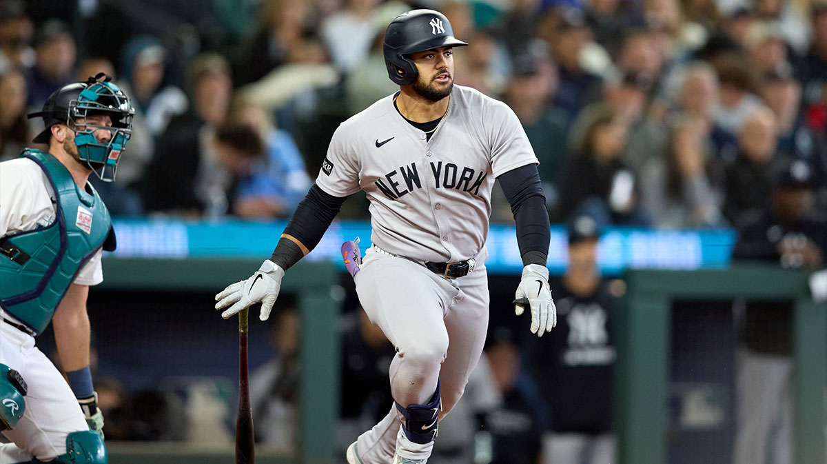 New York Yankees left fielder Jasson Dominguez (24) hits an RBI doube against the Seattle Mariners during the sixth inning at T-Mobile Park.