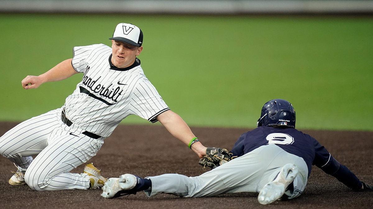 Xavier center fielder Aedan Anderson (9) steals second base under Vanderbilt second baseman Jayden Davis (3) during the fourth inning at Hawkins Field