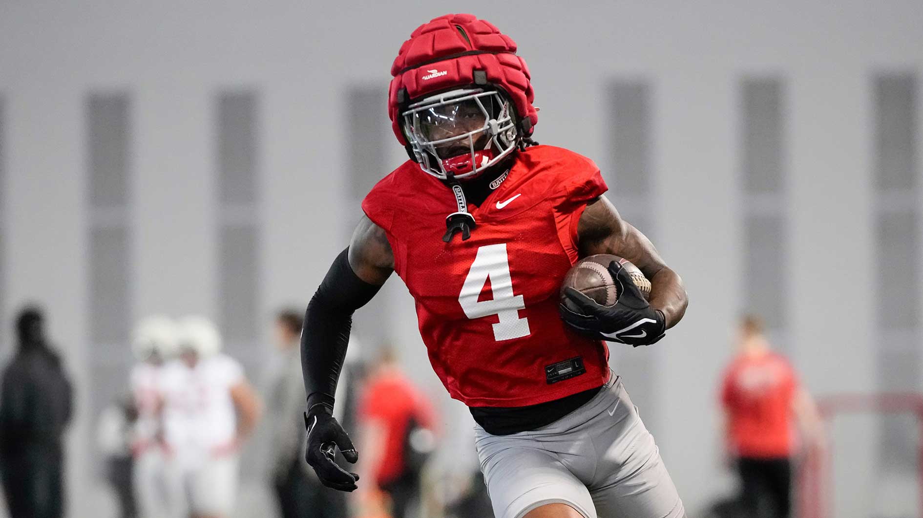 Ohio State Buckeyes wide receiver Jeremiah Smith (4) runs during spring football practice at the Woody Hayes Athletic Center