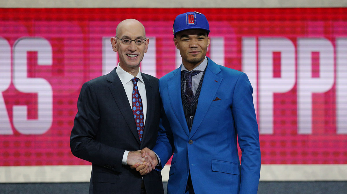 Jerome Robinson (Boston College) greets NBA commissioner Adam Silver after being selected as the number thriteen overall pick to the LA Clippers in the first round of the 2018 NBA Draft at the Barclays Center.