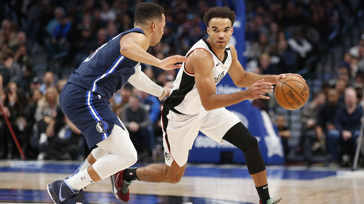 LA Clippers guard Jerome Robinson (1) dribbles against Dallas Mavericks guard Jalen Brunson (13) during the fourth quarter at American Airlines Center.