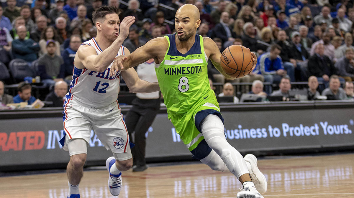 Minnesota Timberwolves guard Jerryd Bayless (8) drives to the basket past Philadelphia 76ers guard T.J. McConnell (12) in the second half at Target Center.