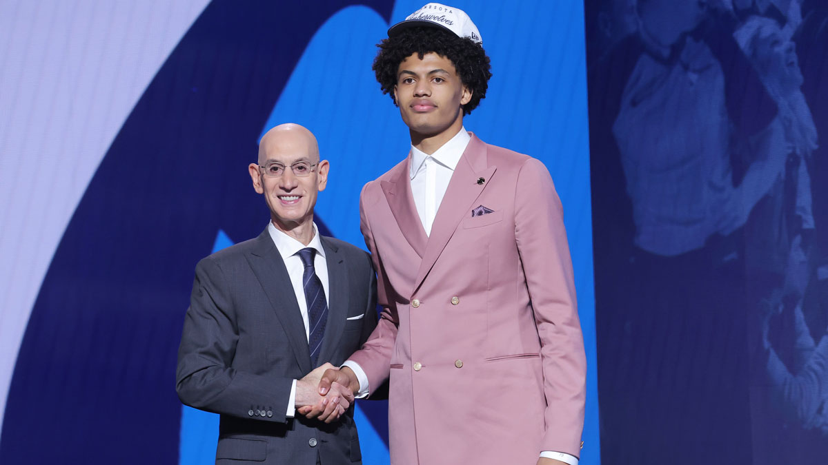 Joan Beringer stands with NBA commissioner Adam Silver after being selected as the 17th pick by the Minnesota Timberwolves in the first round of the 2025 NBA Draft at Barclays Center.