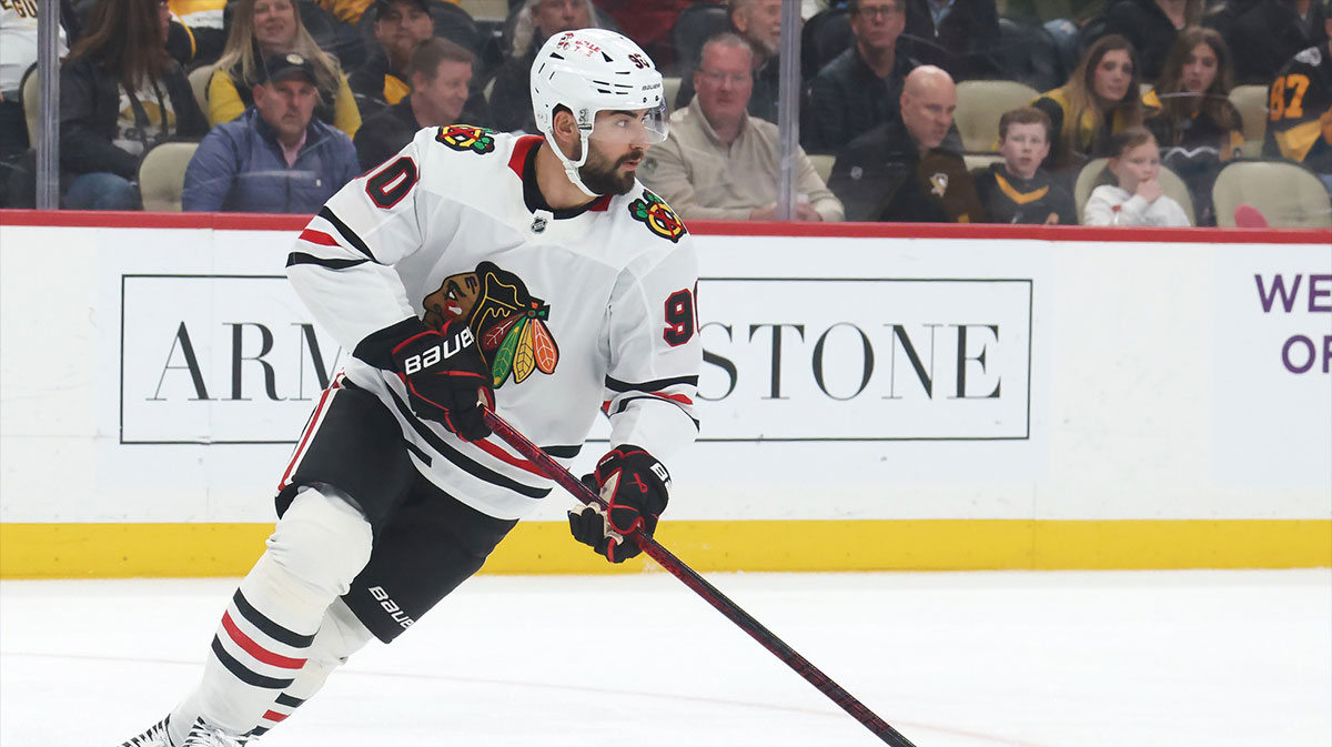 Chicago Blackhawks center Joe Veleno (90) skates with the puck against the Pittsburgh Penguins during the first period at PPG Paints Arena.