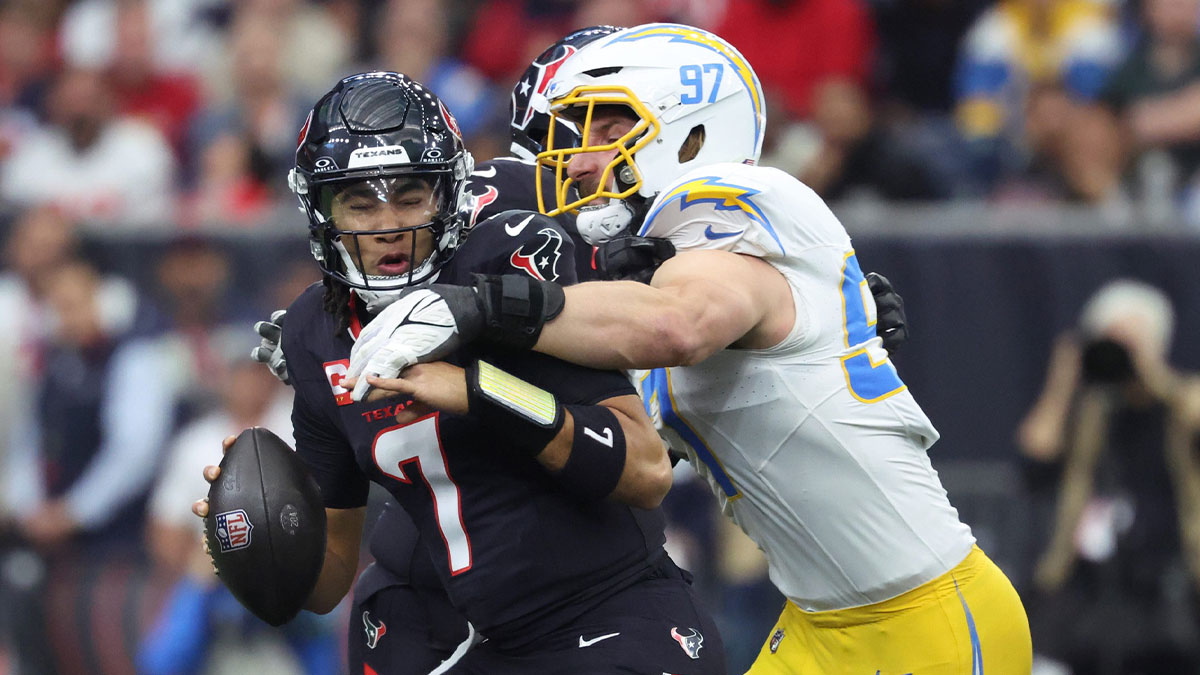 Los Angeles Chargers outside linebacker Joey Bosa (97) sacks Houston Texans quarterback C.J. Stroud (7) during the first quarter in an AFC wild card game at NRG Stadium.