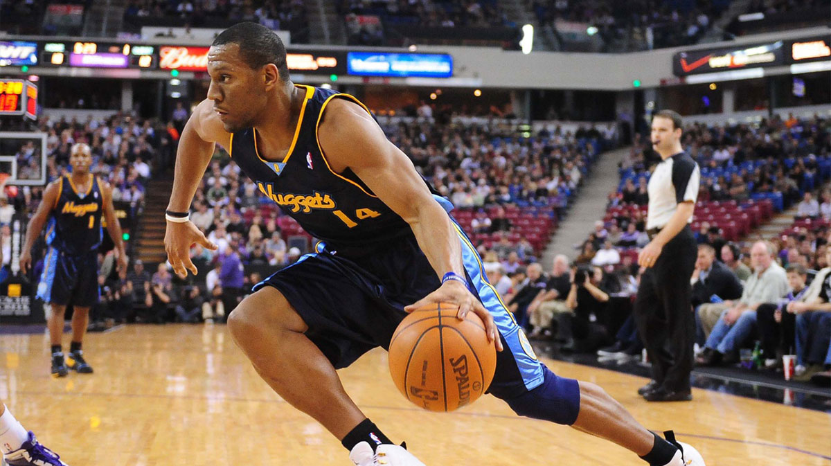 Denver Nuggets guard Joey Graham (14) dribbles toward the basket during the first quarter against the Sacramento Kings at Arco Arena. The Kings defeated the Nuggets 102-100.