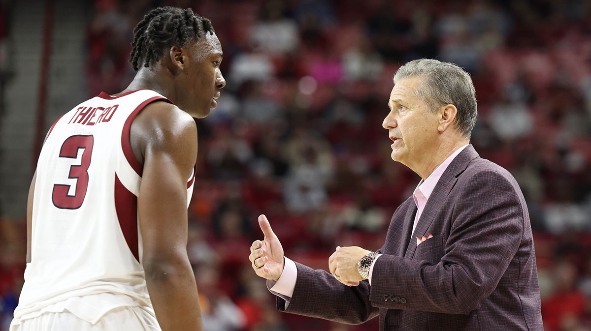 Arkansas Razorbacks head coach John Calipari talks to forward Adou Thiero (3) during the second half against the Little Rock Trojans at Bud Walton Arena. Arkansas won 79-67.