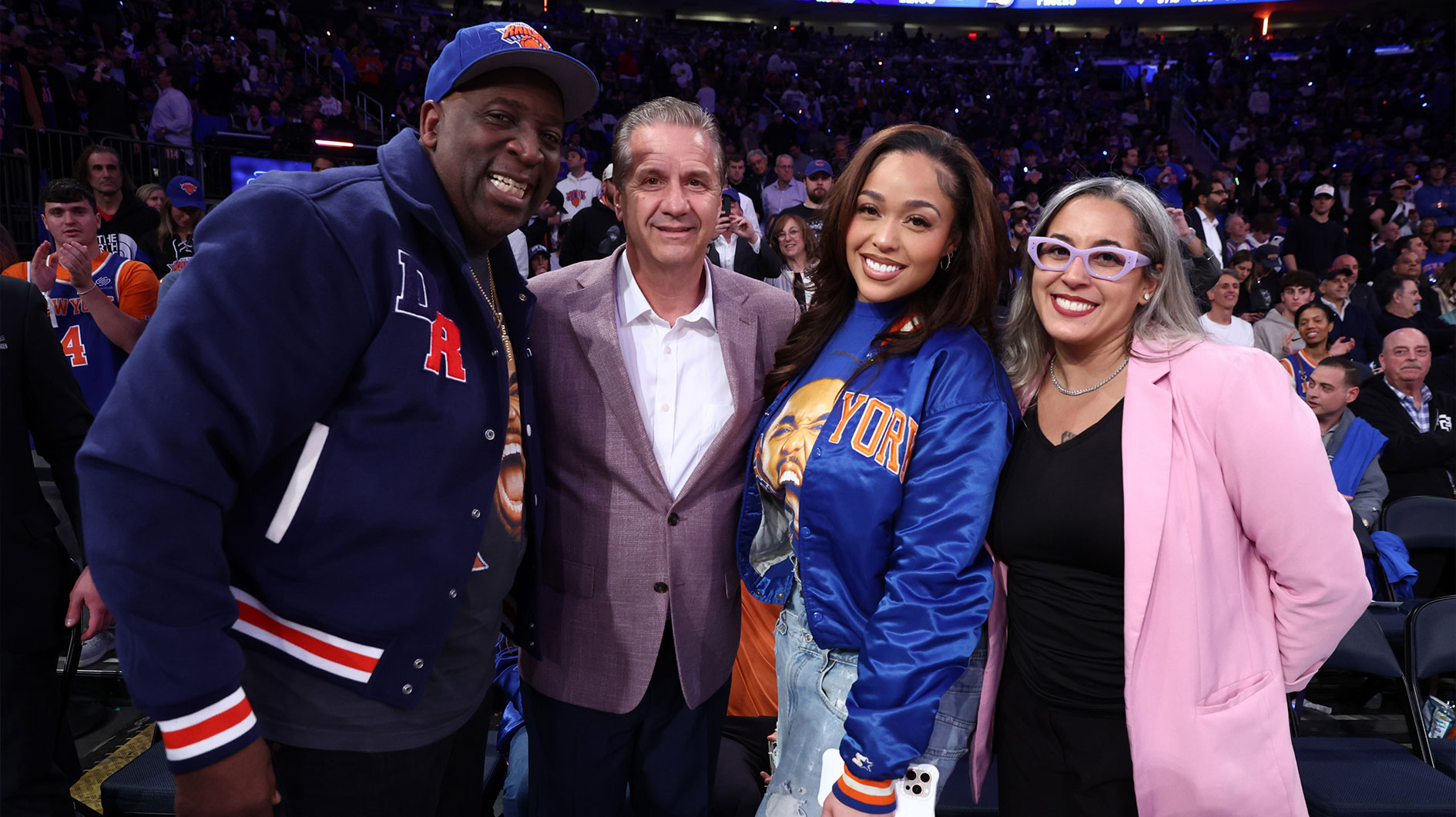 John Calipari poses for a photo with New York Knicks center Karl-Anthony Towns (32) girlfriend Jordyn Woods and his father Karl Towns Senior before the third quarter between the Indiana Pacers and the New York Knicks during game one of the eastern conference finals for the 2025 NBA Playoffs at Madison Square Garden.