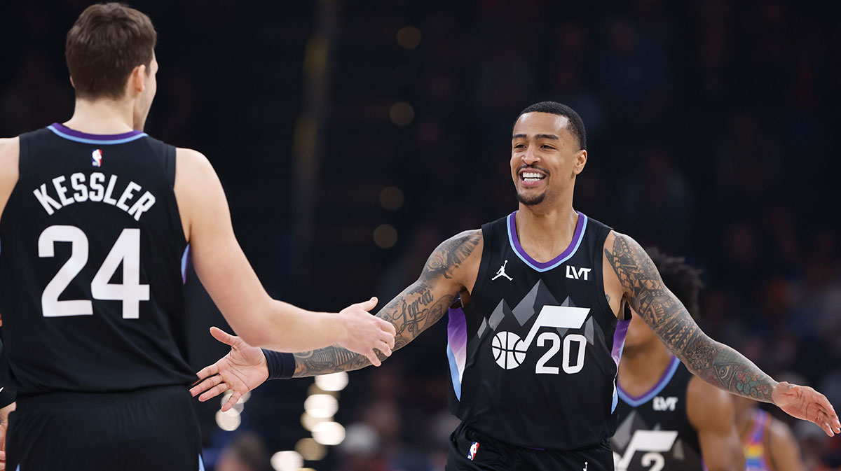 Utah Jazz forward John Collins (20) celebrates with Utah Jazz center Walker Kessler (24) after scoring against the Oklahoma City Thunder during the first quarter at Paycom Center.