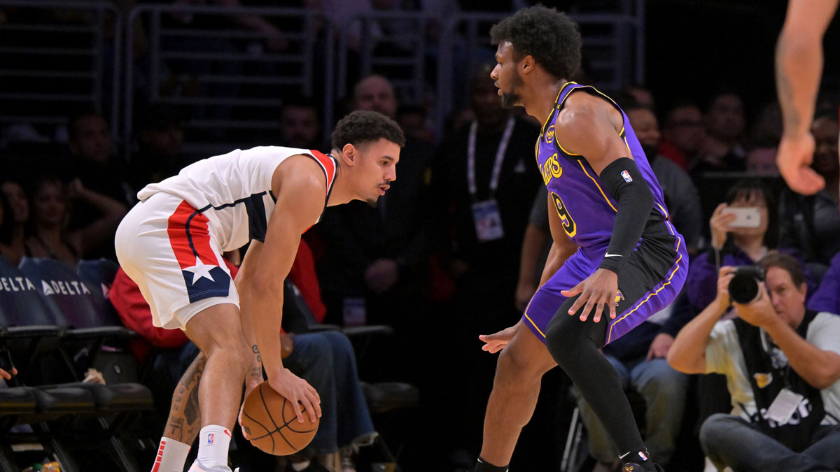 Los Angeles Lakers guard Bronny James (9) guards Washington Wizards guard Johnny Davis (1) in the second half at Crypto.com Arena.