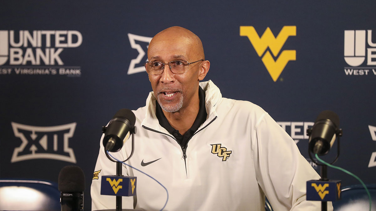 UCF Knights head coach Johnny Dawkins answers questions from the media following a defeat against the West Virginia Mountaineers at WVU Coliseum.