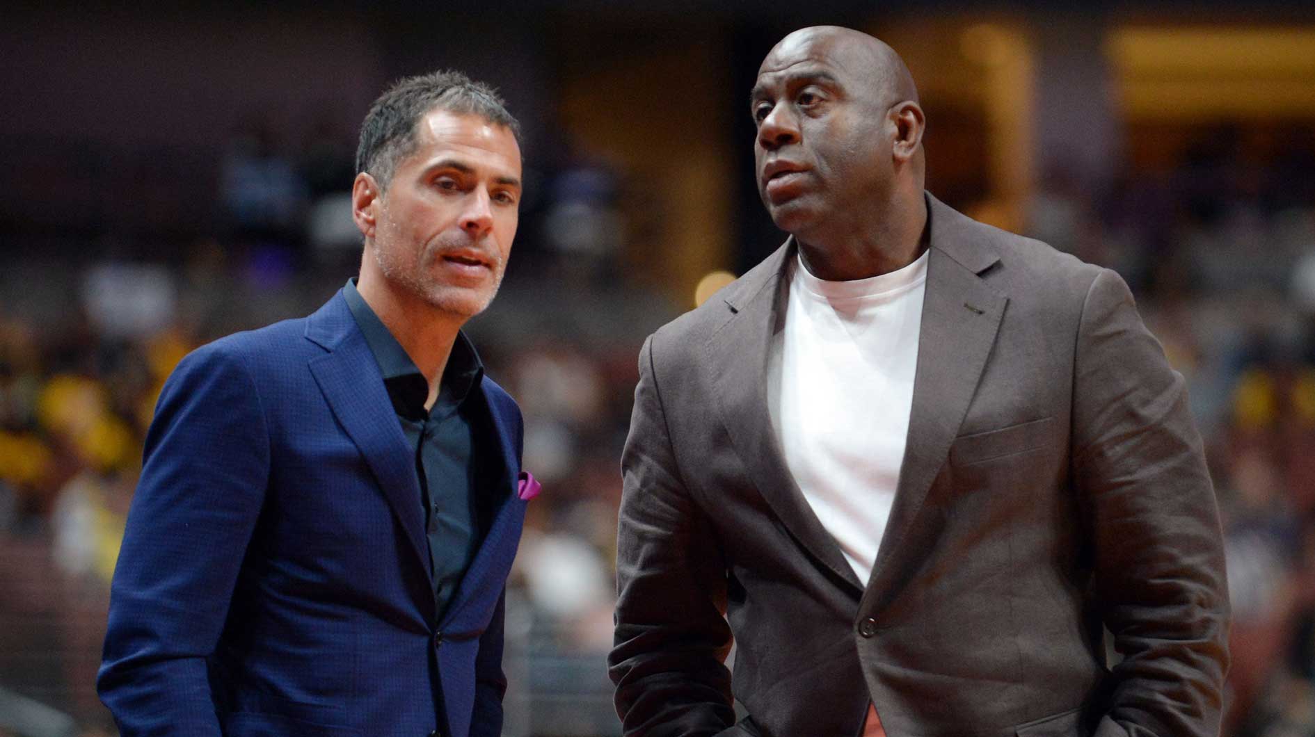 Los Angeles Lakers general manager Rob Pelinka speaks with president of basketball operations Magic Johnson at Honda Center.