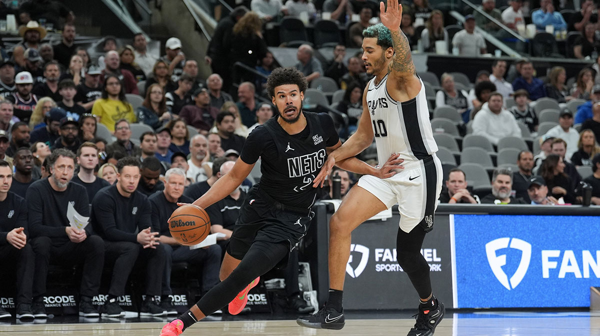 Brooklyn Nets forward Cameron Johnson (2) dribbles past San Antonio Spurs forward Jeremy Sochan (10) in the second half at Frost Bank Center.