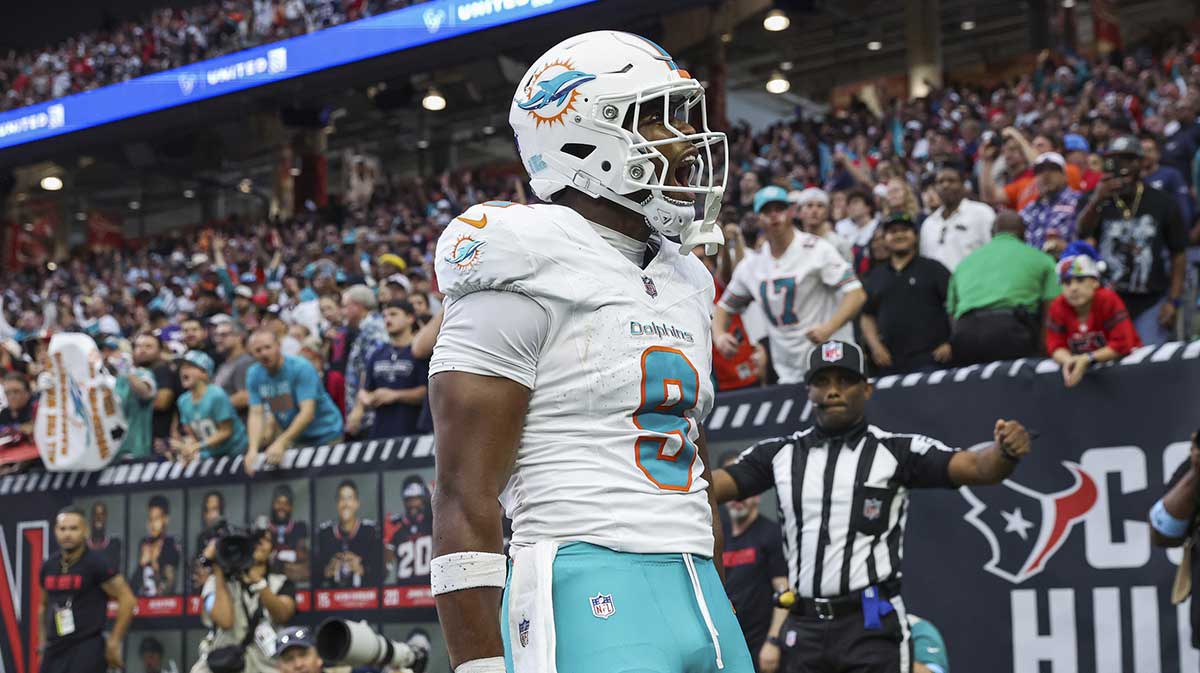 Miami Dolphins tight end Jonnu Smith (9) reacts after a touchdown reception during the game against the Houston Texans at NRG Stadium.