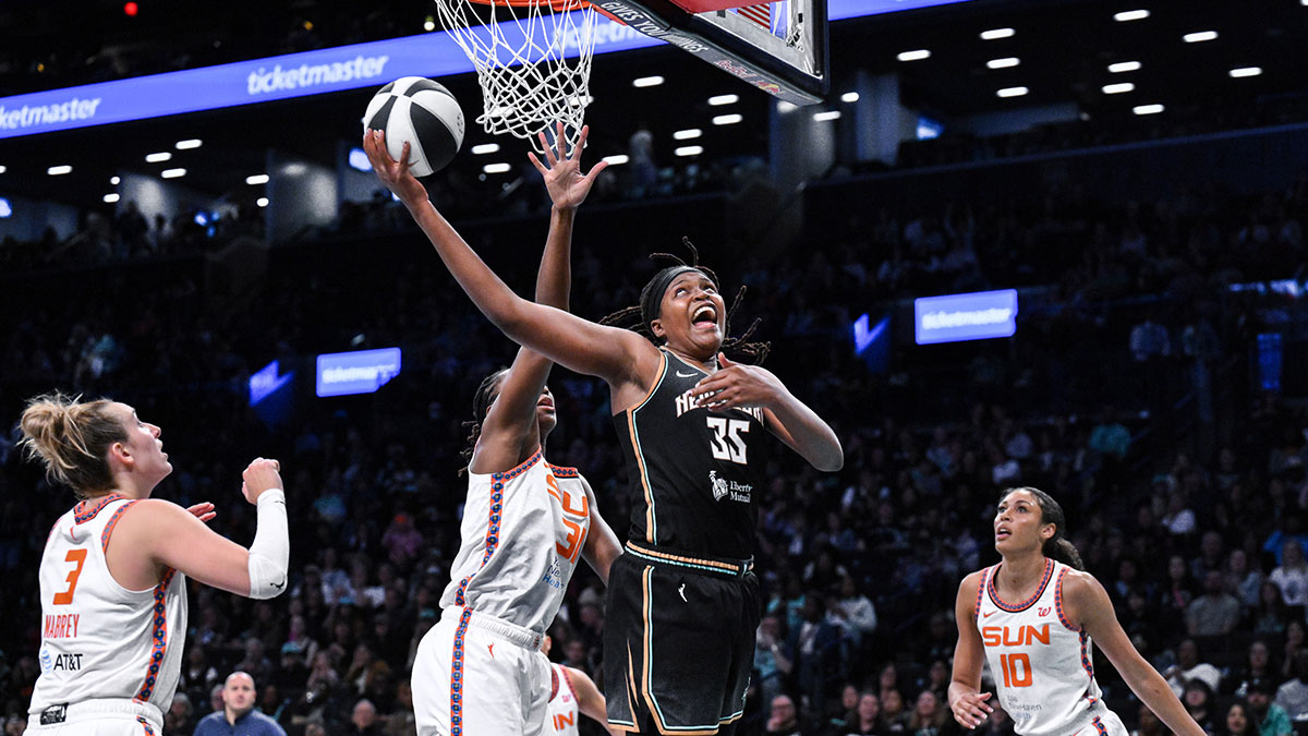 New York Liberty center Jonquel Jones (35) shoots the ball while being defended by Connecticut Sun center Tina Charles (31) during the second half at Barclays Center.