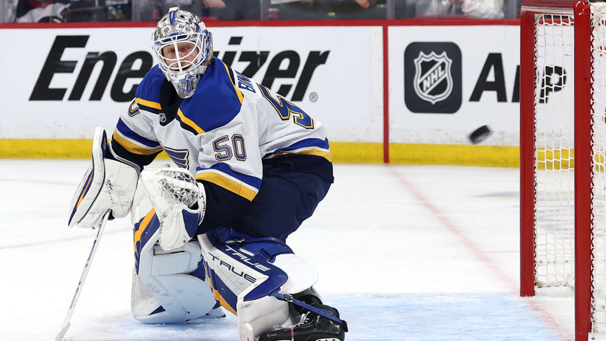 St. Louis Blues goaltender Jordan Binnington (50) eyes the puck against the Winnipeg Jets in the second period in game seven of the first round of the 2025 Stanley Cup Playoffs at Canada Life Centre.