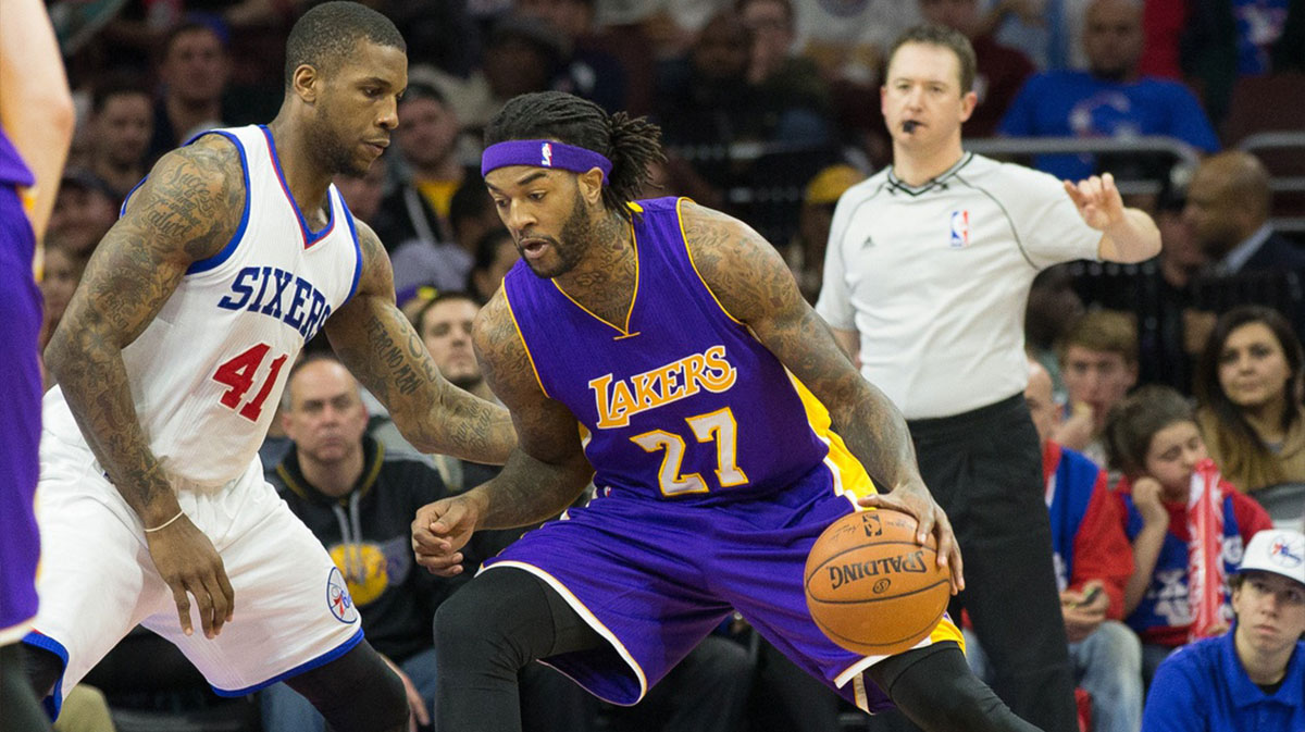 Los Angeles Lakers center Jordan Hill (27) drives against Philadelphia 76ers forward Thomas Robinson (41) at Wells Fargo Center. The Lakers won 113-111 in overtime.