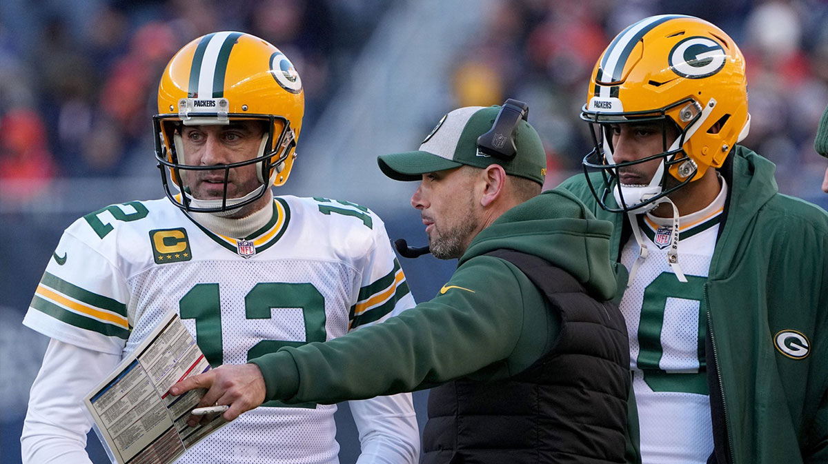 Green Bay Packers quarterback Aaron Rodgers (12) and quarterback Jordan Love (10) listen to head coach Matt LaFleur during the fourth quarter of their game Sunday, December 4, 2022 at Soldier Field in Chicago, Ill. The Green Bay Packers beat the Chicago Bears 28-19.