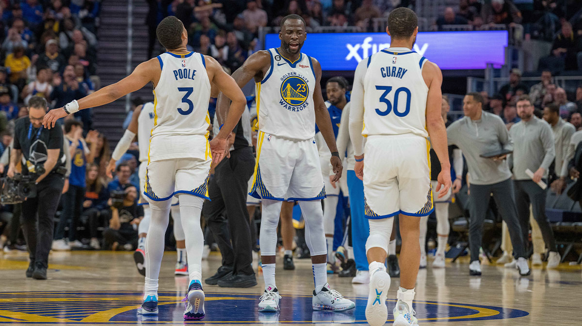 ; Golden State Warriors forward Draymond Green (23) and Golden State Warriors guard Jordan Poole (3) and Golden State Warriors guard Stephen Curry (30) celebrate during a timeout against the Philadelphia 76ers during the fourth quarter at Chase Center.