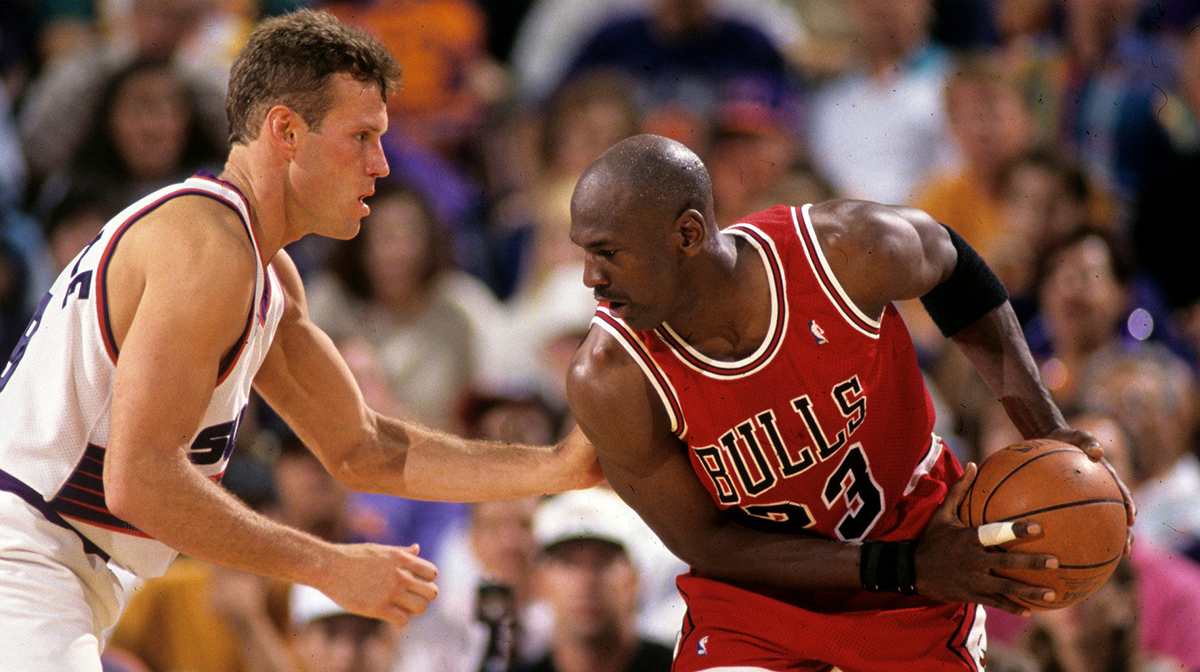 Suns guard Dan Majerle defends Bulls guard Michael Jordan during Game 1 of the NBA Finals in 1993 in Phoenix.