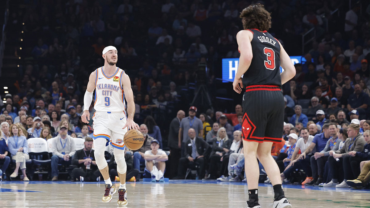 Oklahoma City Thunder guard Alex Caruso (9) dribbles down the court against Chicago Bulls guard Josh Giddey (3) during the second quarter at Paycom Center.