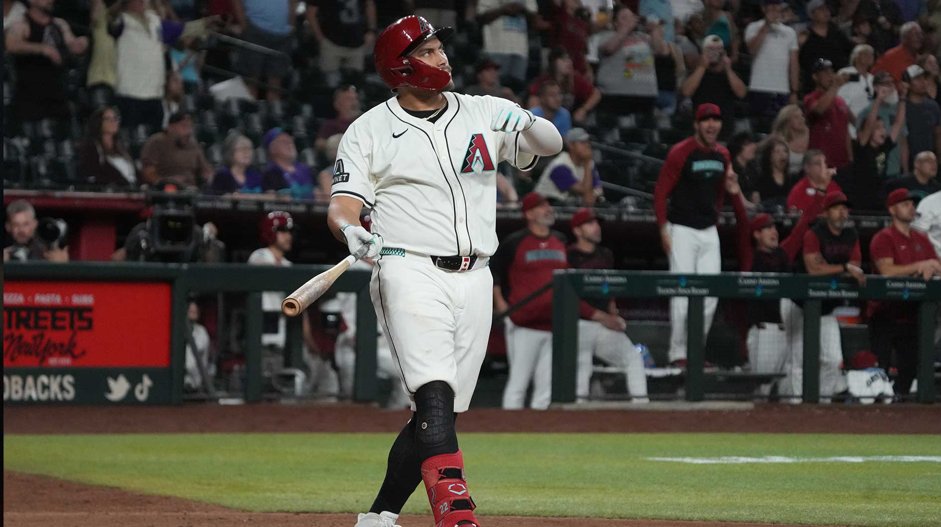 Arizona Diamondbacks first base Josh Naylor (22) hits a walk off grand slam home run against the Seattle Mariners in the eleventh inning at Chase Field.