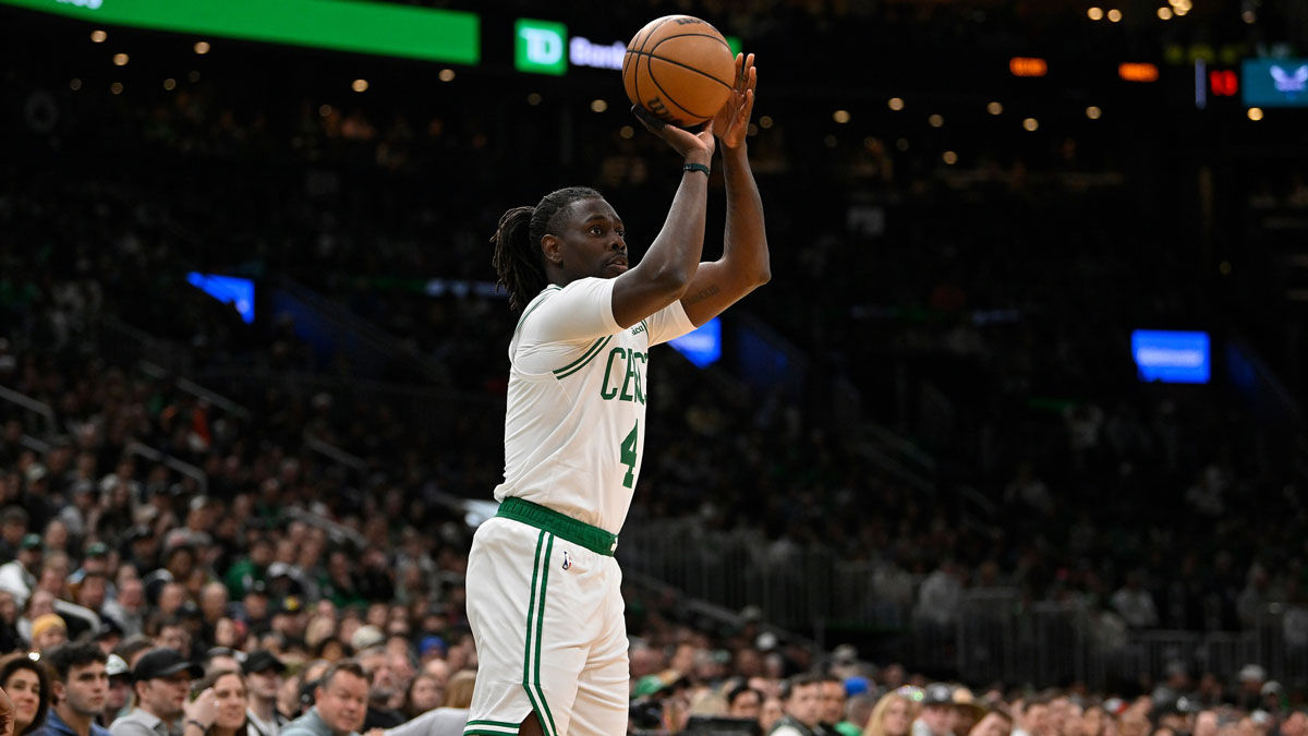 Boston Celtics guard Jrue Holiday (4) shoots the ball against the Charlotte Hornets in the first half at TD Garden.