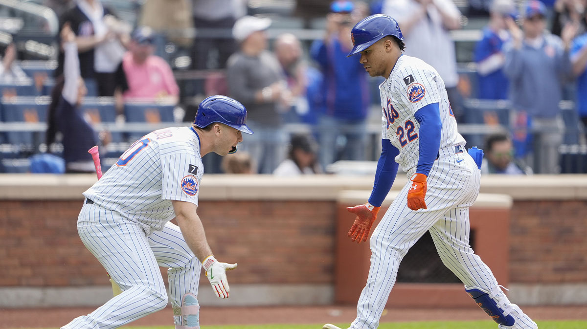 New York Mets first baseman Pete Alonso (20) congratulates New York Mets right fielder Juan Soto (22) for hitting a home run against the Colorado Rockies during the eighth inning at Citi Field