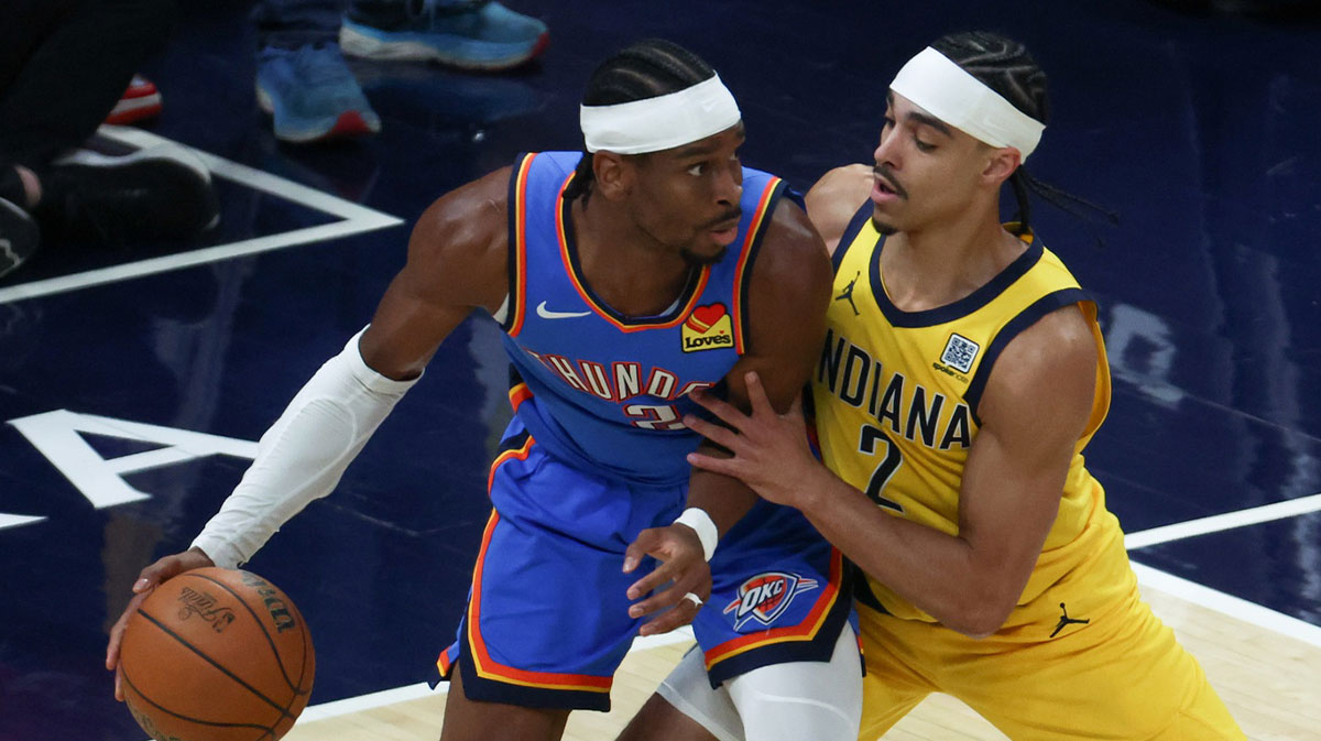 Indiana Pacers guard Andrew Nembhard (2) defends against Oklahoma City Thunder guard Shai Gilgeous-Alexander (2) in the first quarter during game six of the 2025 NBA Finals at Gainbridge Fieldhouse.