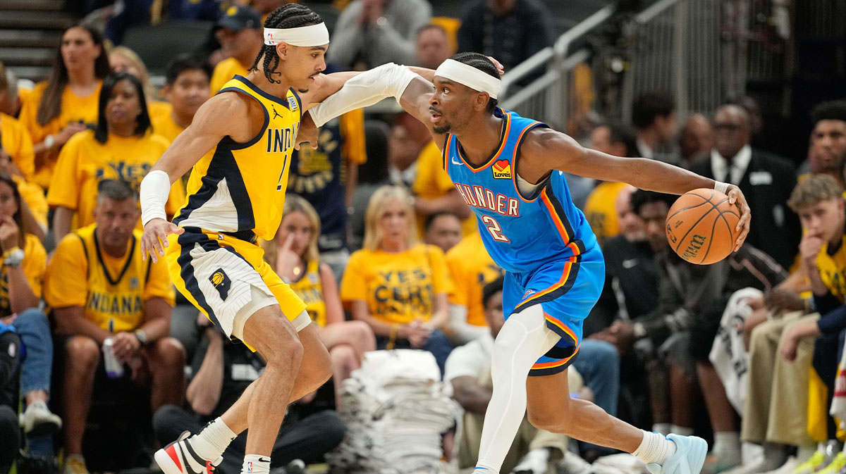 Oklahoma City Thunder guard Shai Gilgeous-Alexander (2) dribbles the ball defended by Indiana Pacers guard Andrew Nembhard (2) in the third quarter during game six of the 2025 NBA Finals at Gainbridge Fieldhouse.