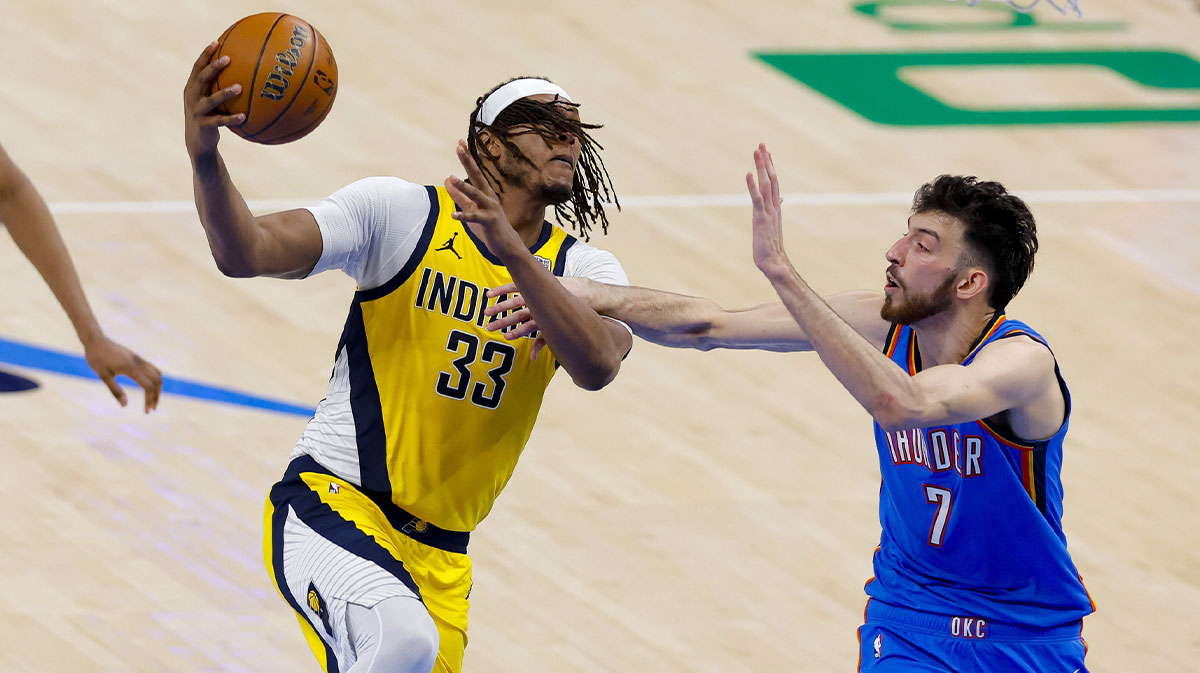 Indiana Pacers center Myles Turner (33) drives to the basket past Oklahoma City Thunder forward Chet Holmgren (7) during the third quarter of game two of the 2025 NBA Finals at Paycom Center.