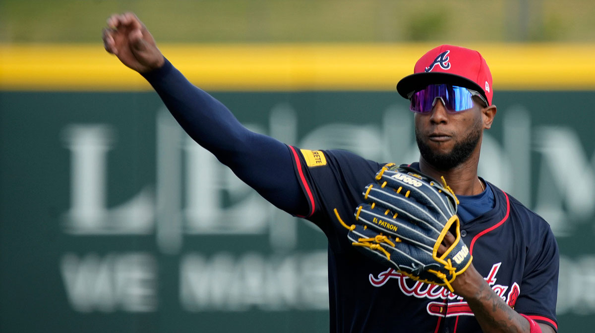 Atlanta Braves outfielder Jurickson Profar warms up at a spring training workout
