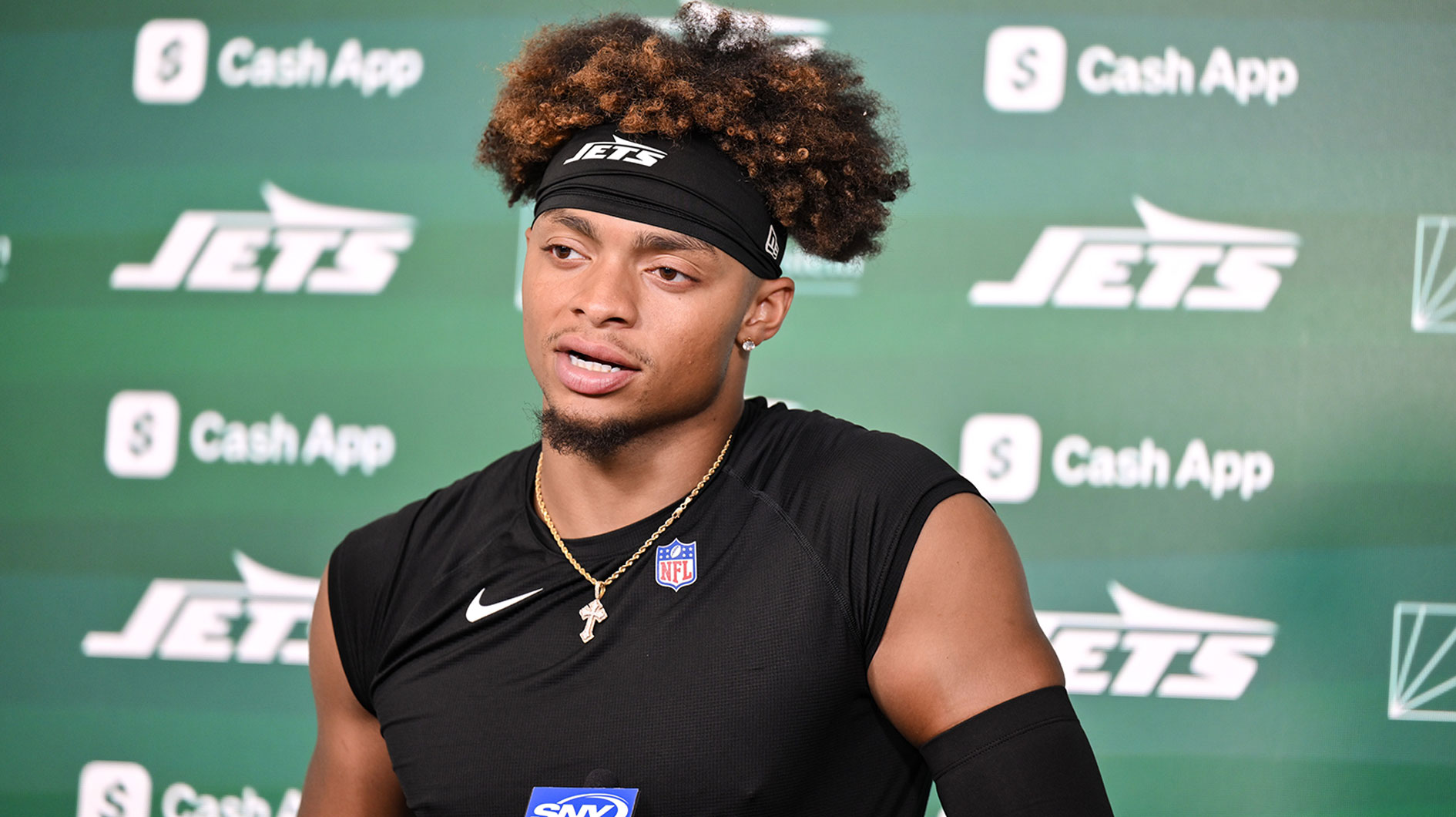New York Jets quarterback Justin Fields (7) speaks at a press conference during minicamp at Atlantic Health Jets Training Center.