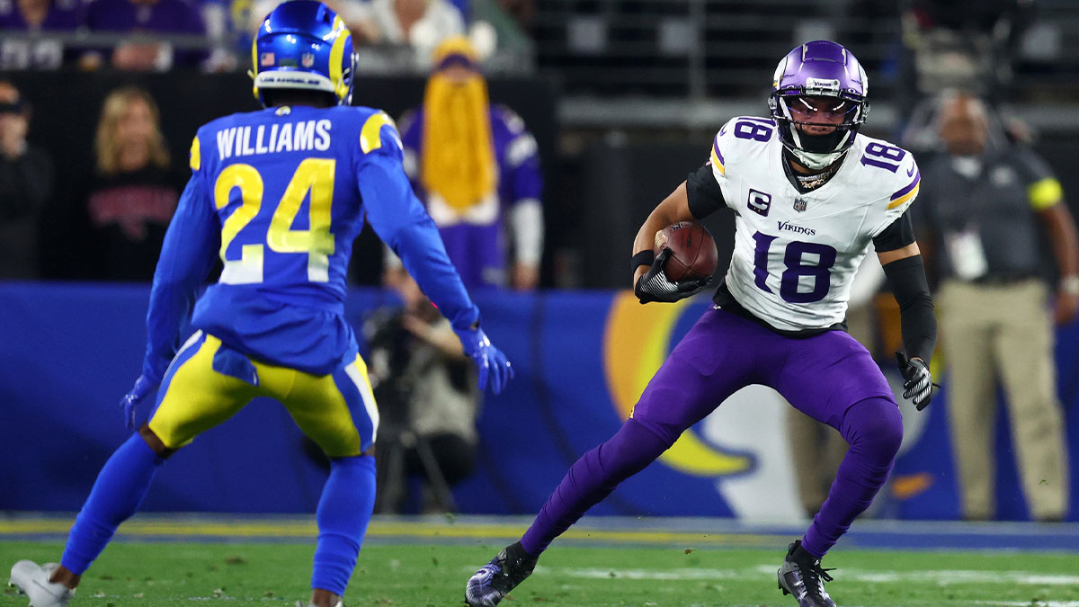 Minnesota Vikings wide receiver Justin Jefferson (18) makes a catch against Los Angeles Rams cornerback Darious Williams (24) during the first half in an NFC wild card game at State Farm Stadium.